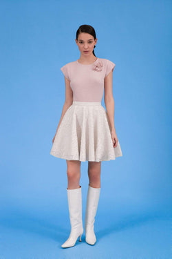 Front view of Audrey faux leather laser cut skirt in icy ivory