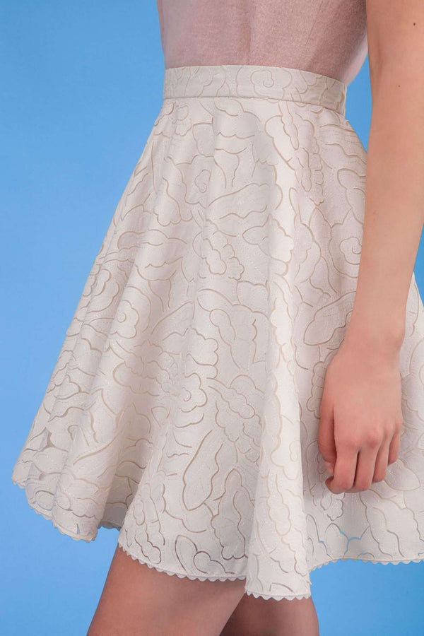 Closer look of Audrey faux leather laser cut skirt in icy ivory